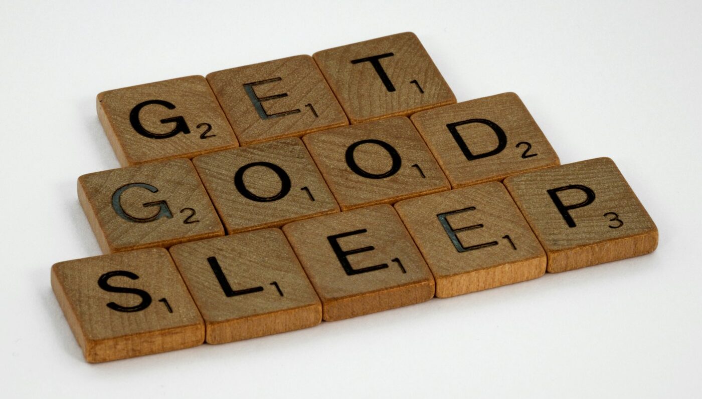 brown wooden letter blocks on white surface
