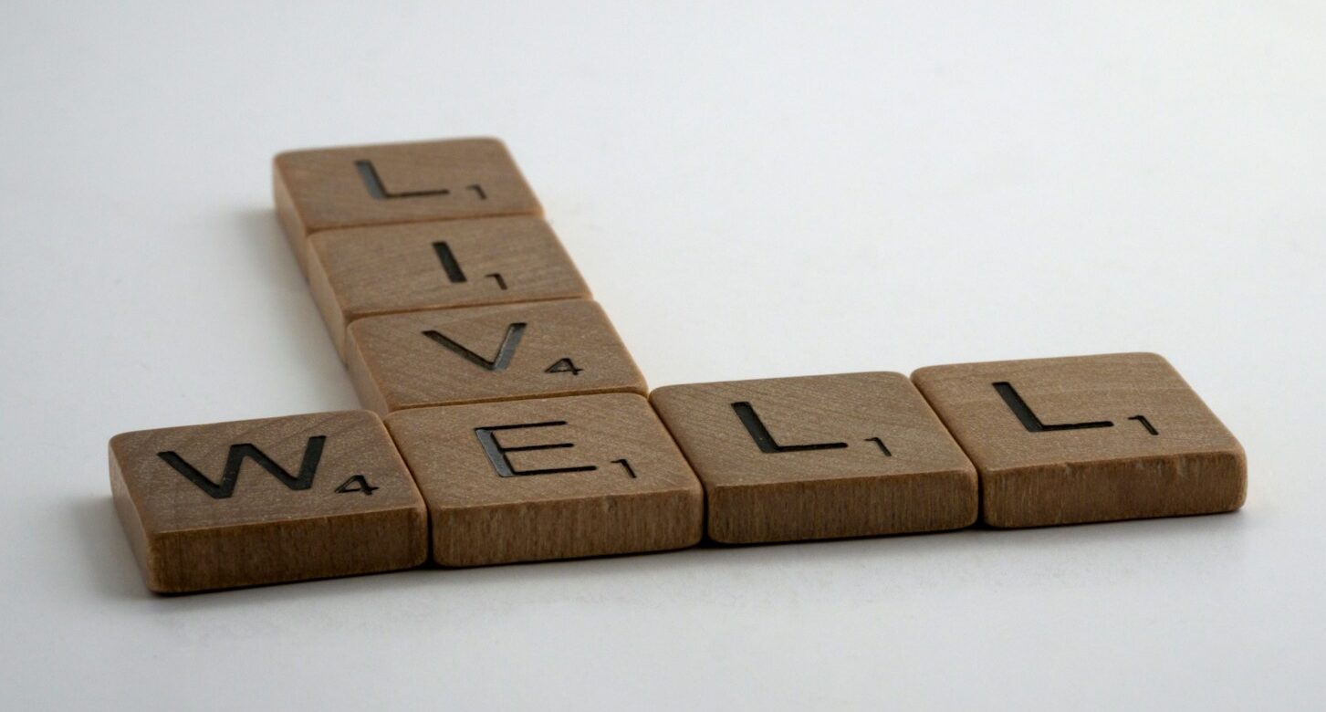 brown wooden letter blocks on white surface